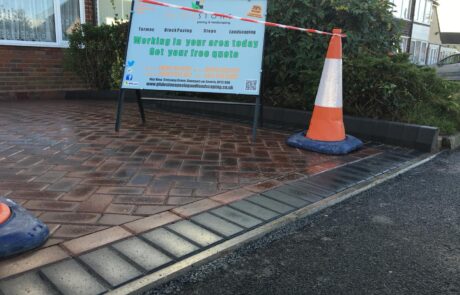 Traditional red herringbone block paving with a professional charcoal border finish for a local driveway in the Stoke Prior area.