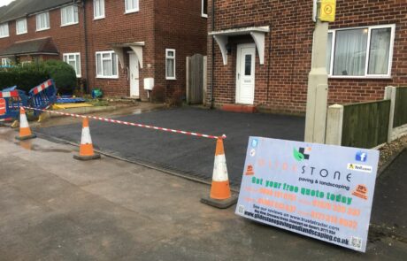 Freshly laid heavy-duty tarmac driveway featuring neat brick edging and integrated drainage, serving the B60 Aston Fields area.